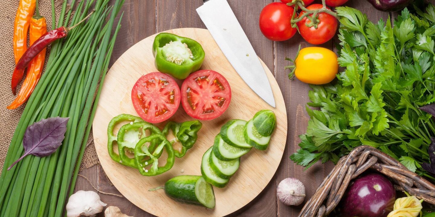 Fresh produce in cutting board - Sustainable and Plant-Based Food Innovations | NSF